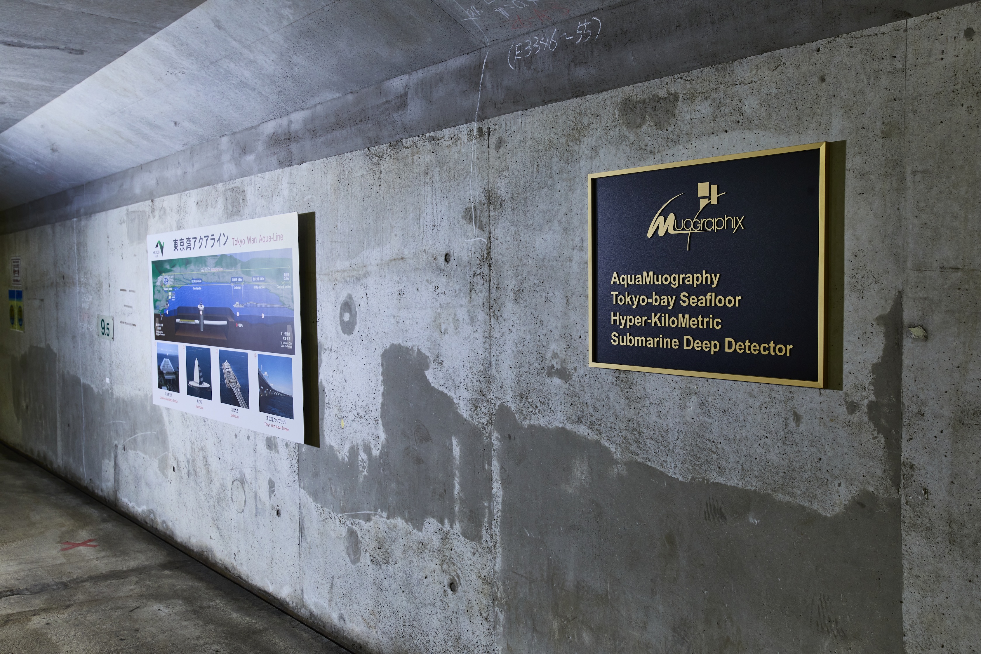 Concrete wall, a gold plaque on the right